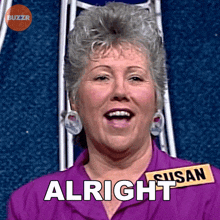 a woman with a name tag that says susan is smiling and saying " alright "