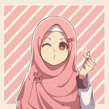 a girl in a pink hijab is making a heart sign with her finger