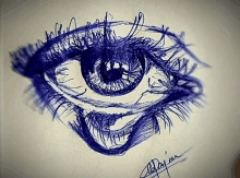 a drawing of a woman 's eye with a signature on the bottom of it