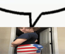 a woman in an american flag shorts is standing in front of a door