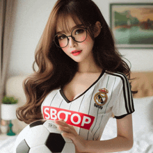 a girl wearing a soccer jersey that says sbotop on it