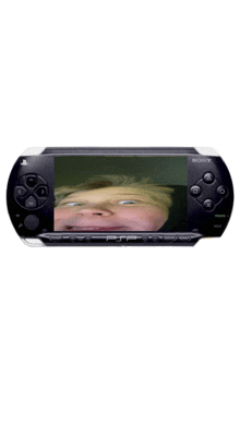 a sony psp with a picture of a child on the screen