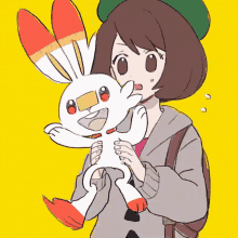 a girl is holding a white rabbit with red and orange ears