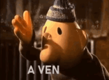 a cartoon character wearing a hat is waving his hand in front of a sign that says a ven .