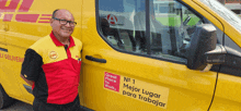 a man standing next to a yellow van that says great place to work