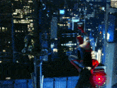 a man in a spiderman costume is flying over a city