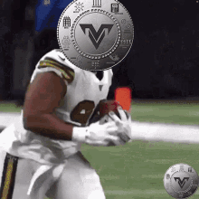 a football player with a coin with the letter v on it 's head