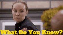 a woman in a firefighter uniform is asking the question what do you know