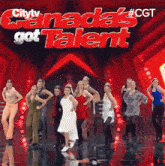 a group of women are dancing on a stage with the words canada 's got talent