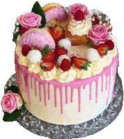 a cake with pink frosting and strawberries and cupcakes