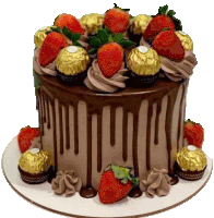 a chocolate cake with strawberries and chocolates on top