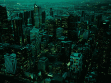 a black and white photo of a city skyline with a building that says ' chase ' on the top