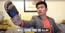 a man in a suit is holding a remote control and says i will send you to allah