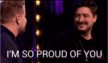 two men are standing next to each other with the words " i 'm so proud of you " on the bottom