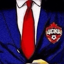 a man is wearing a blue suit and a red tie with a badge on his chest that says ucska .