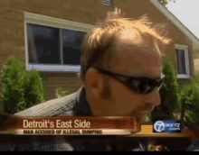 a man wearing sunglasses is being interviewed by a news channel called detroit 's east side