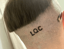 the back of a person 's head with the word loc written on it