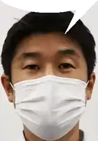 a close up of a man wearing a face mask .