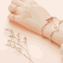 a close up of a person 's wrist with jewel nista written above it