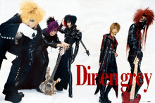 a group of people standing next to each other with the word diren grey in red