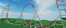 a roller coaster going through a circle with a blue sky in the background