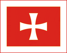 a red background with a white cross in the center