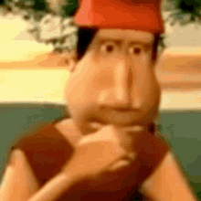 a cartoon character wearing a red hat is thinking .