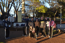 a group of young people posing for a picture with one wearing a sweatshirt that says abercrombie