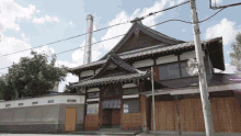 a large building with a chimney on top of it and a sign that says ' a ' on it