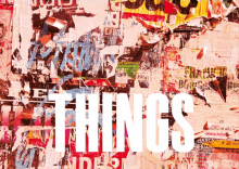 the word things is on a wall with a lot of posters on it