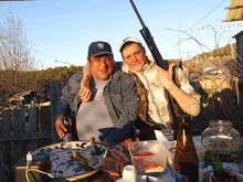 two men posing for a picture with one wearing a hat that says wb on it