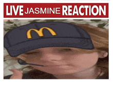 a picture of a child wearing a mcdonald 's hat and a sign that says live jasmine reaction