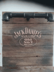 a wooden sign with jack daniel 's old no.7 brand written on it