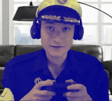 a man wearing a police hat and headphones is holding a video game controller