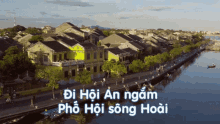 an aerial view of a city with the words di hoi an ngam pho hoi song hoai written below it