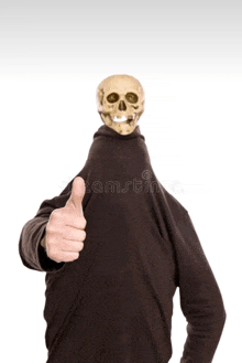 a person with a skull on their head is giving a thumbs up