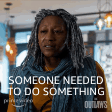 a poster for the outlaws shows a woman with dreadlocks and the words " someone needed to do something "