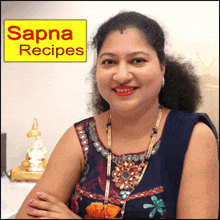 a woman smiles in front of a yellow sign that says sapna recipes