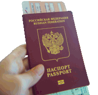 a person is holding a russian federation passport and a ticket