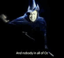 a picture of a witch with the words and nobody in all of oz below her