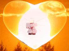 a heart with a person inside of it with a sunset in the background