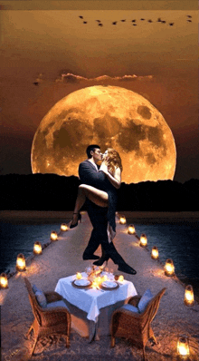 a man is holding a woman in his arms while they kiss in front of a full moon