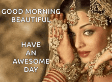 a woman with a lot of jewelry on her face and the words good morning beautiful have an awesome day