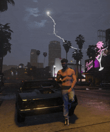 a shirtless man stands in front of a car with a lightning bolt in the background