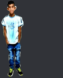 a young boy wearing a white t-shirt and jeans