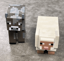 a cow and a sheep from minecraft are on a table