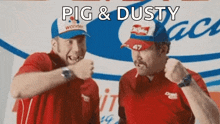 two men are standing next to each other and one of them is wearing a hat that says pig & dusty on it .