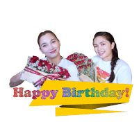 two women holding bouquets of flowers next to a sign that says " happy birthday "