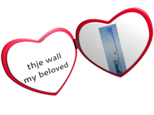 a heart shaped mirror with the words " the wall my beloved " on it