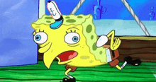 a cartoon of spongebob squarepants with a surprised look on his face and a hat on his head .